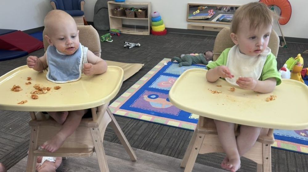 babies at in high chairs at the development center